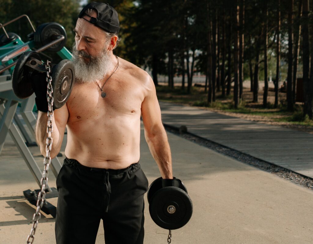 older man lifting weights